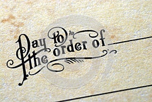 Close-up view of Ã¢â¬ÅPay To The Order OfÃ¢â¬Â photo